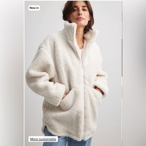 Long zipped teddy jacket in off white - NAKD